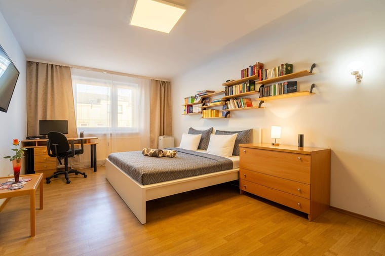 Master Bedroom with Home Office Desk - Stream, Work, or Rest in Vienna’s Bright & Book-Lined Retreat