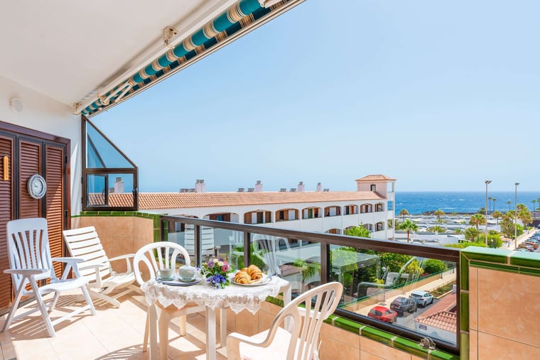 Balcony with Ocean View, Sun Loungers, Dining Table and Chairs