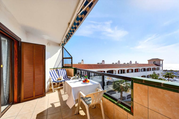Balcony with Ocean View, Sun Loungers, Dining Table and Chairs