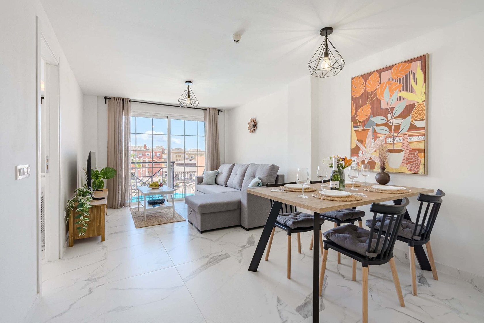 Living Room with TV, Sofa Bed, Dining Table, Coffee Table and Pool View