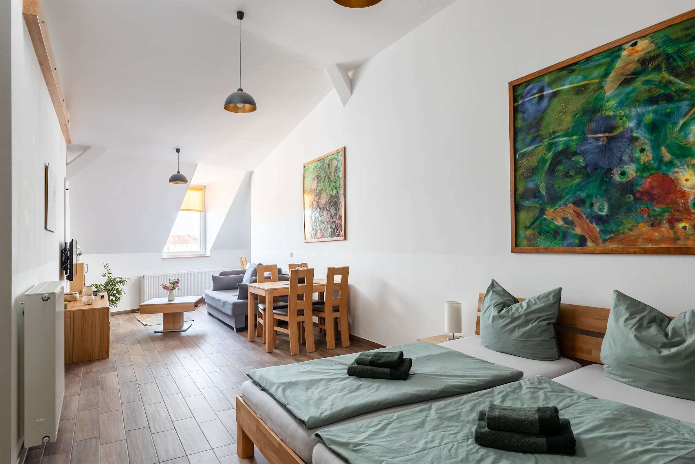 Living Area with a Double Bed, Dining Table, Sofa Bed & Work Station