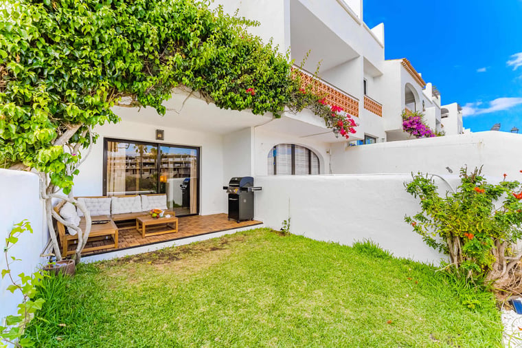 Garden Oasis with Cozy Lounge Under the Vines — Perfect for Sun-Kissed Afternoons or a Relaxing Glass of Wine in the Shade