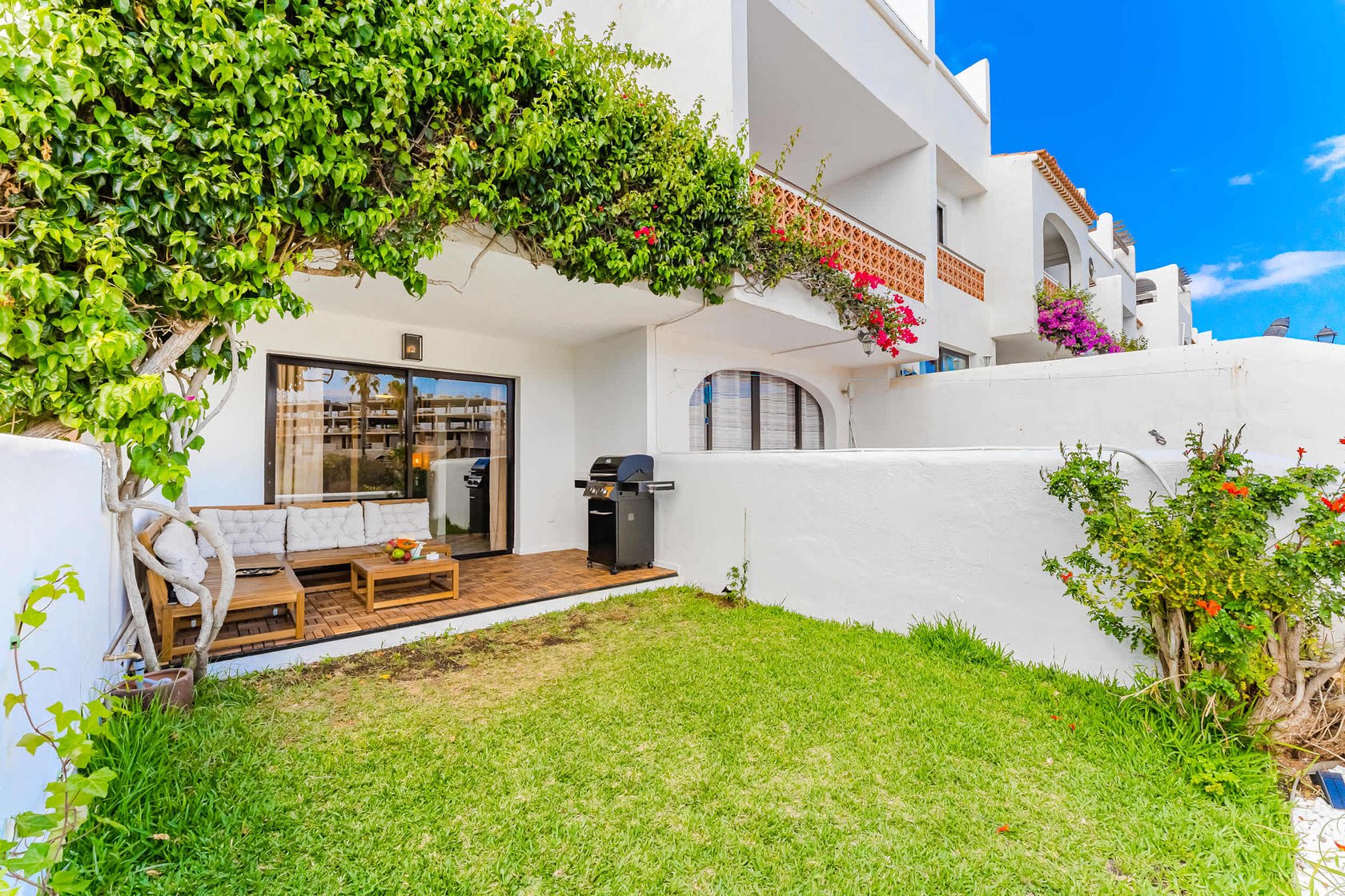Garden Oasis with Cozy Lounge Under the Vines — Perfect for Sun-Kissed Afternoons or a Relaxing Glass of Wine in the Shade