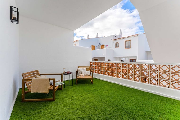 Covered Upper Terrace with Lounge Seating — Your Personal Spot for Morning Coffee, Afternoon Reading, or an Evening Wind-Down