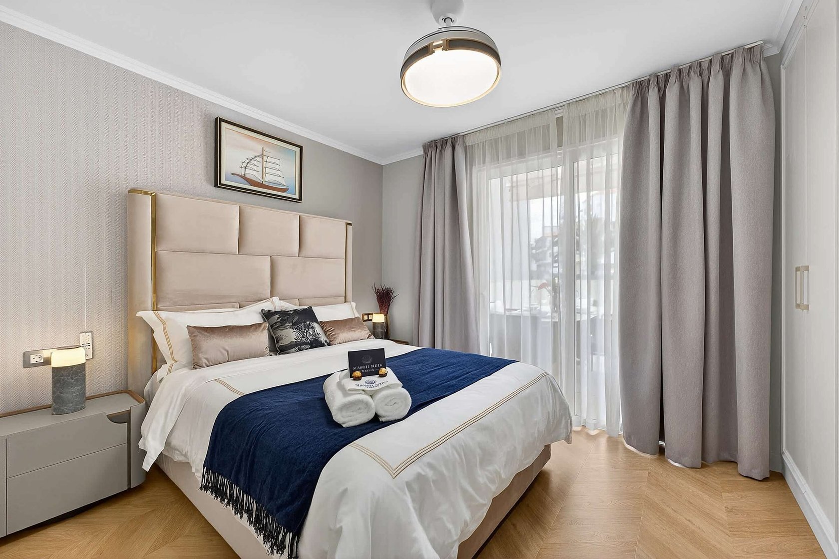 Tranquil Second Bedroom with Sea-Inspired Tones — Wake Refreshed in a Coastal Retreat with Soft Drapes and Plush Bedding