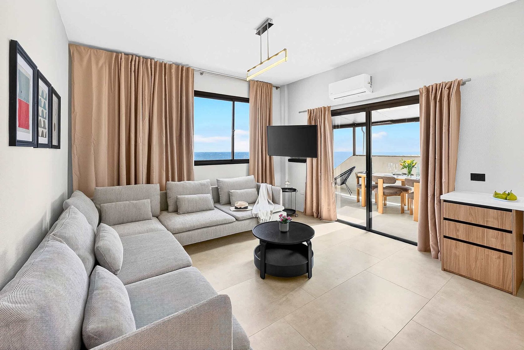 Spacious Living Area with Ocean View, AC, Multimedia TV & Sonos Sound System, Dedicated Working Space & Direct Exit to the Private Roof-Top Terrace