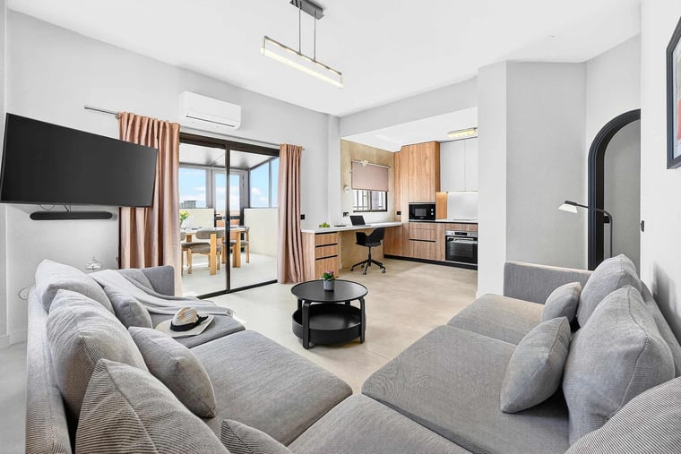 Spacious Living Area with Ocean View, AC, Multimedia TV & Sonos Sound System, Dedicated Working Space & Direct Exit to the Private Roof-Top Terrace