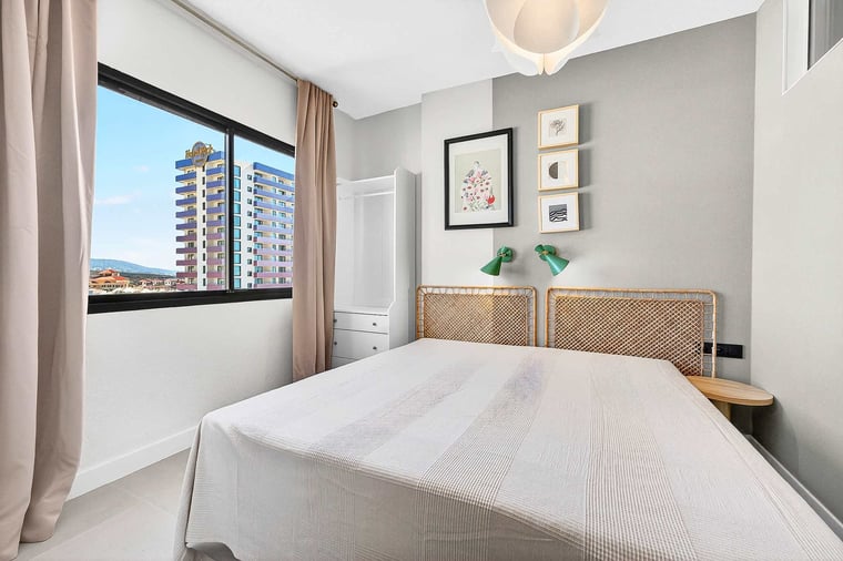 Stylish Bedroom with Rattan Headboard & Views