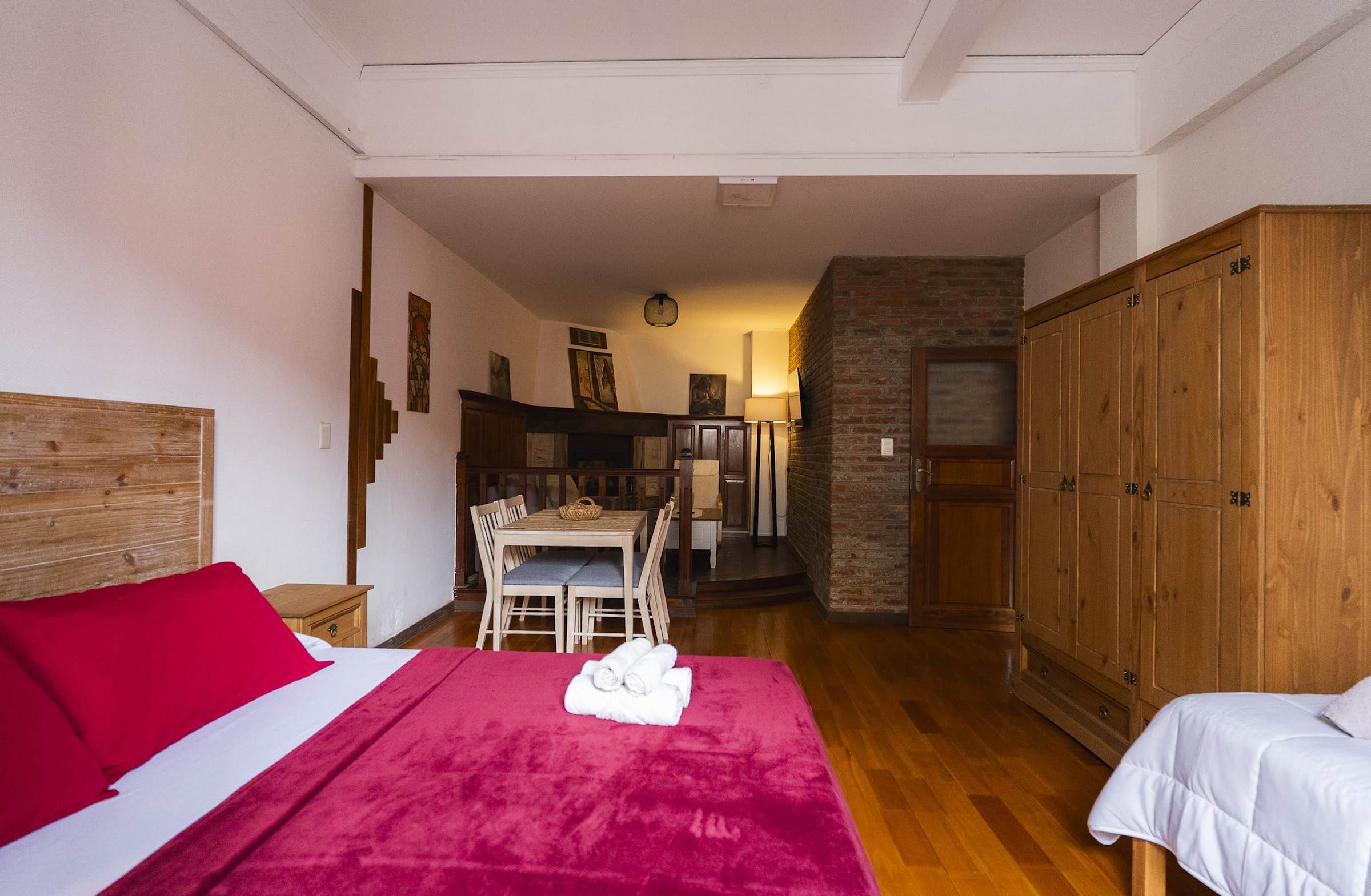 Living Room with Double and Single Bed