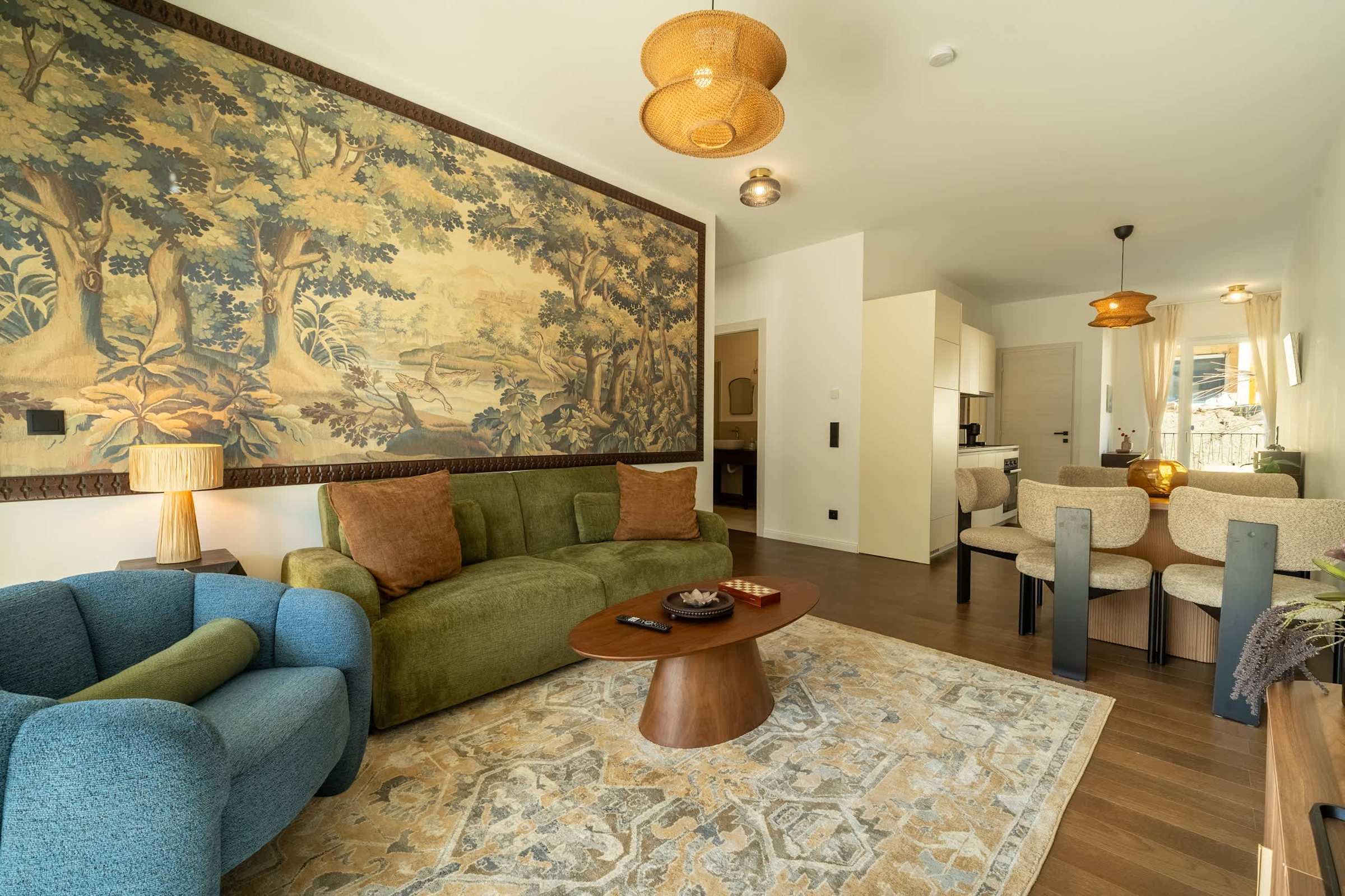 Living room with sofa bed and tapestry wall