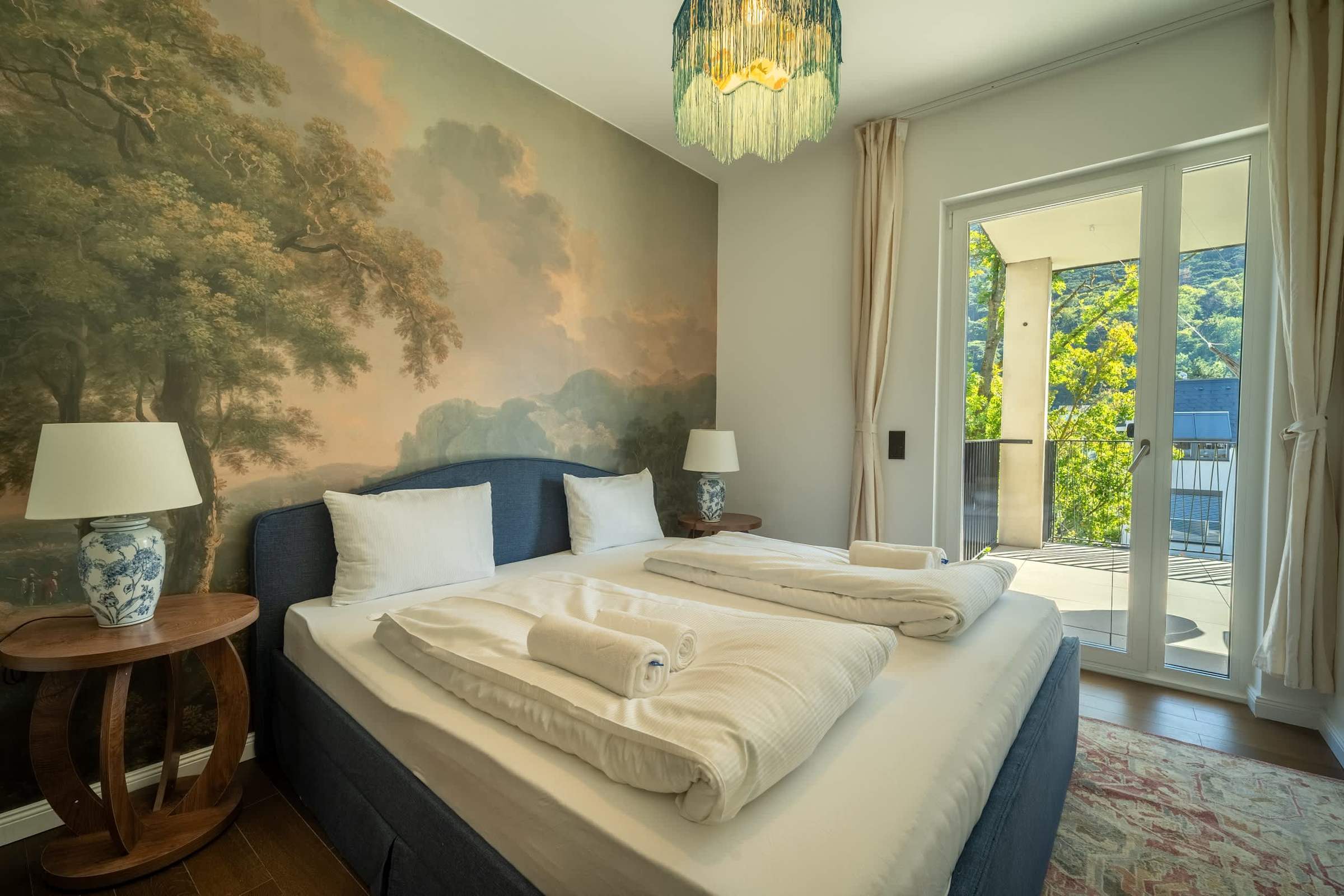 Bedroom 2 with doors to the balcony
