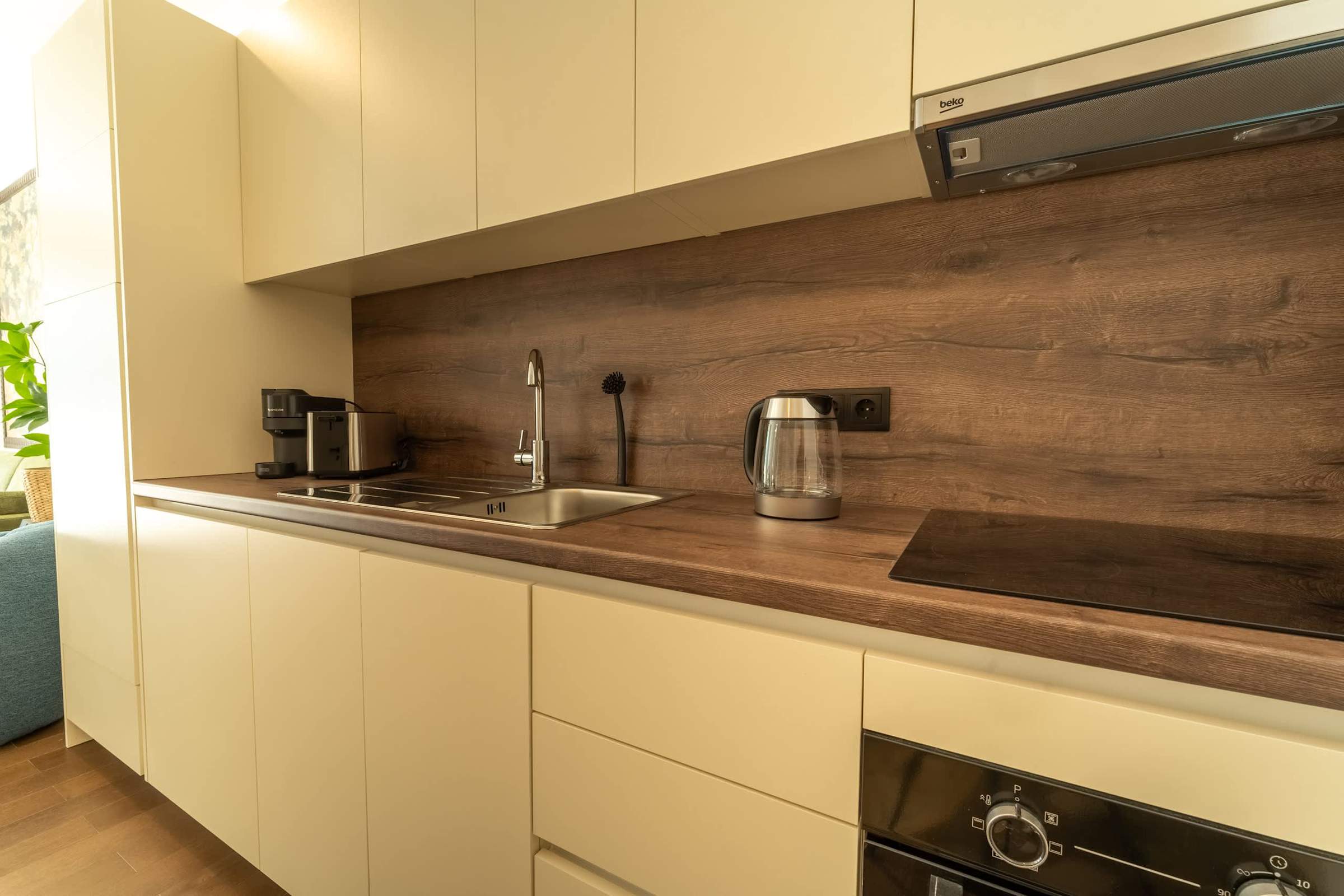 Kitchen with hob, sink and kettle