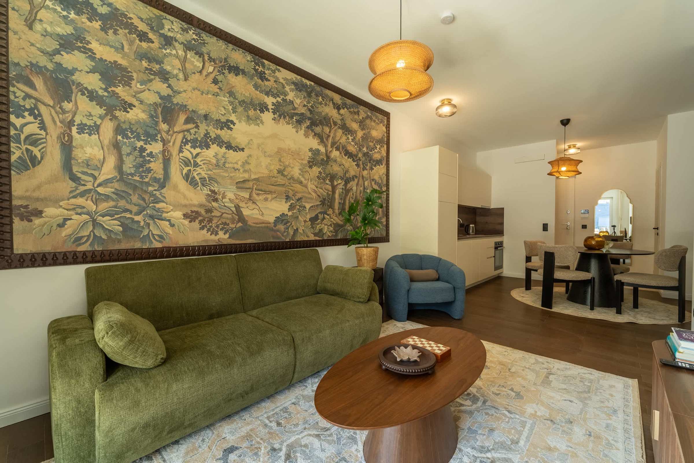 Living room with sofa bed and tapestry wall