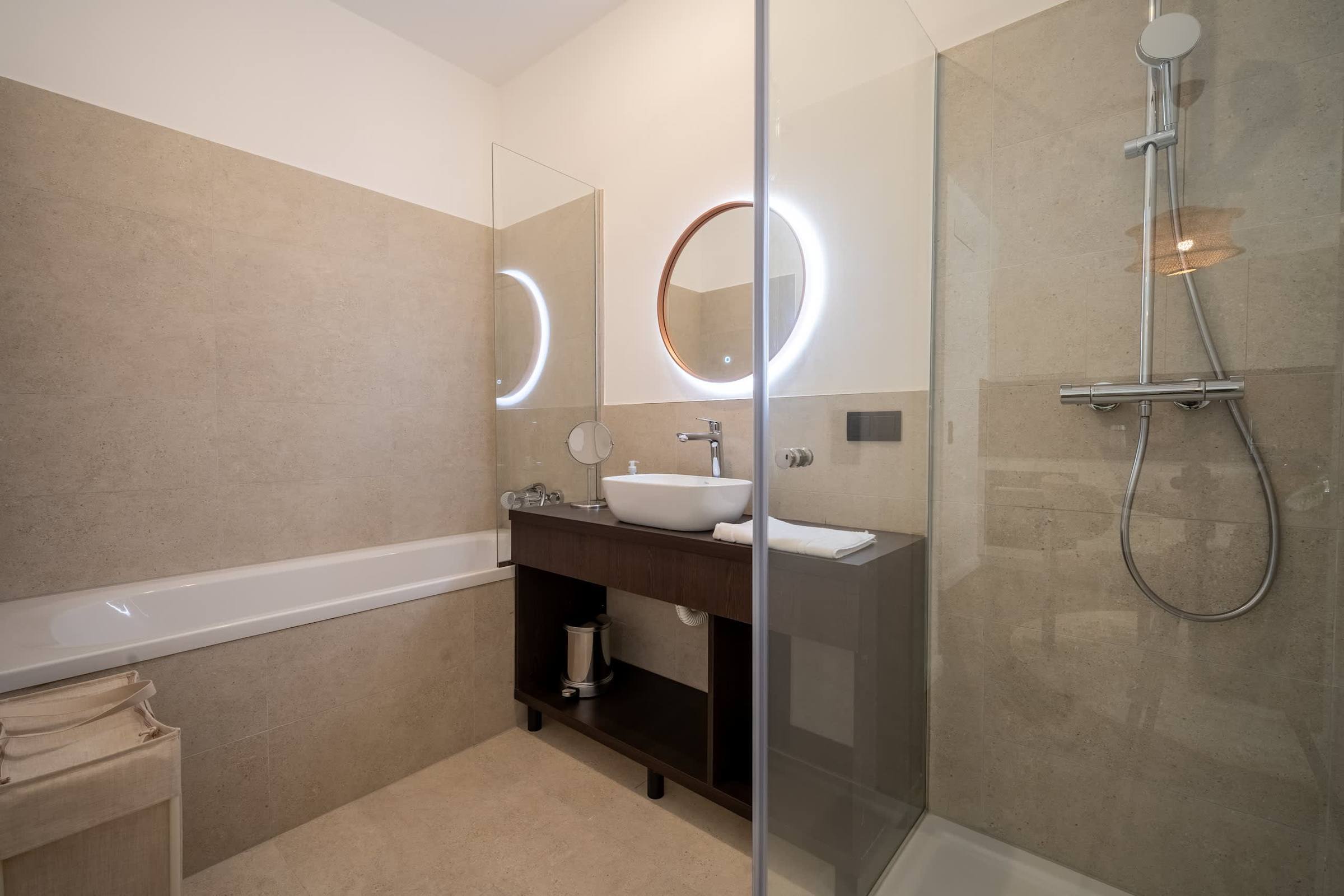 Bathroom with bathtub and walk-in shower