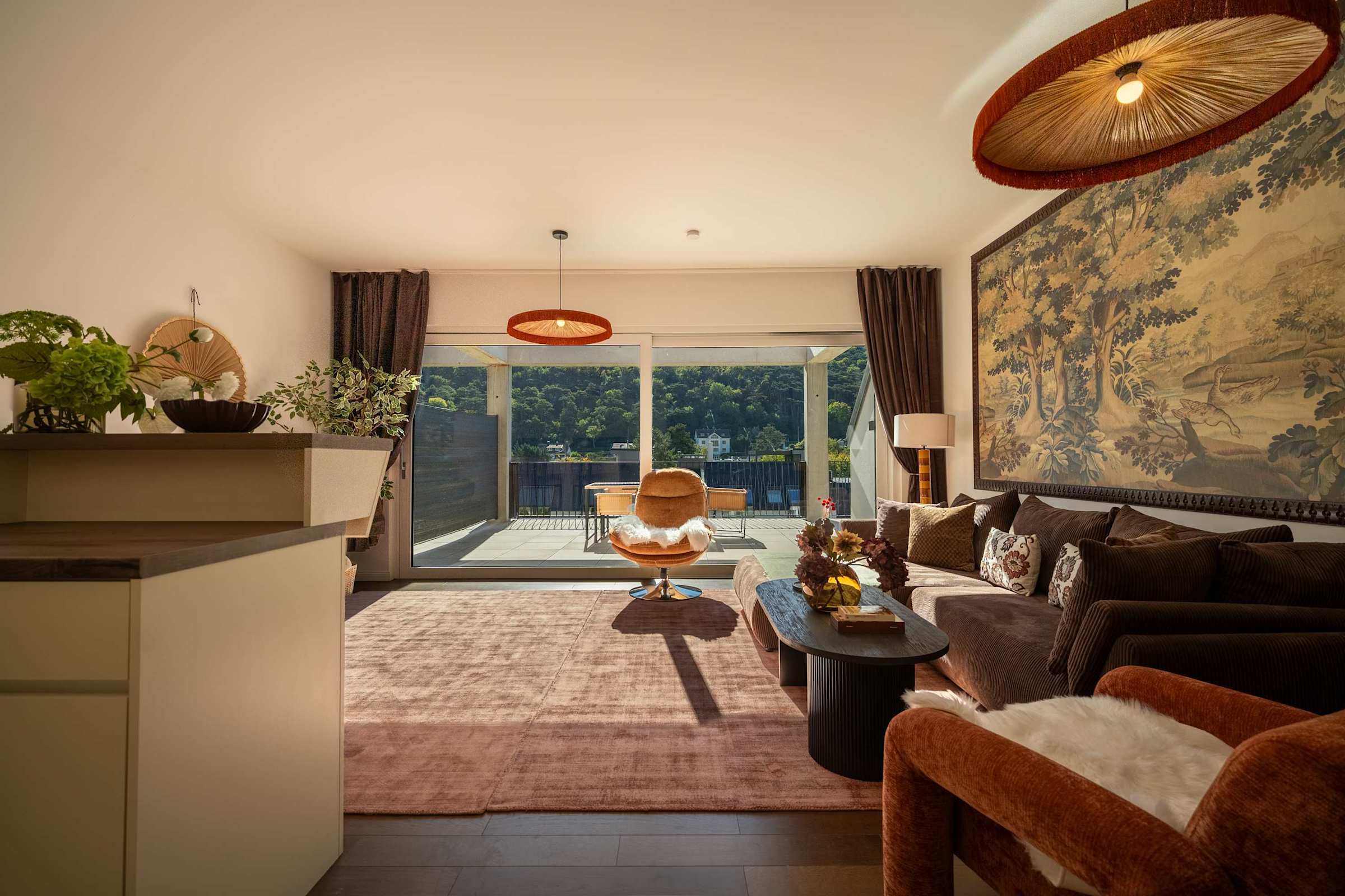 Bright living room with floor-to-ceiling windows onto the terrace